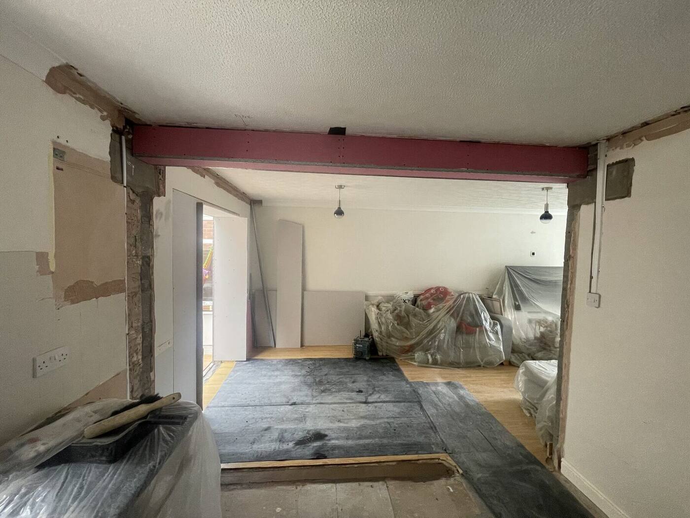 Structural opening formed between rooms during a home alteration