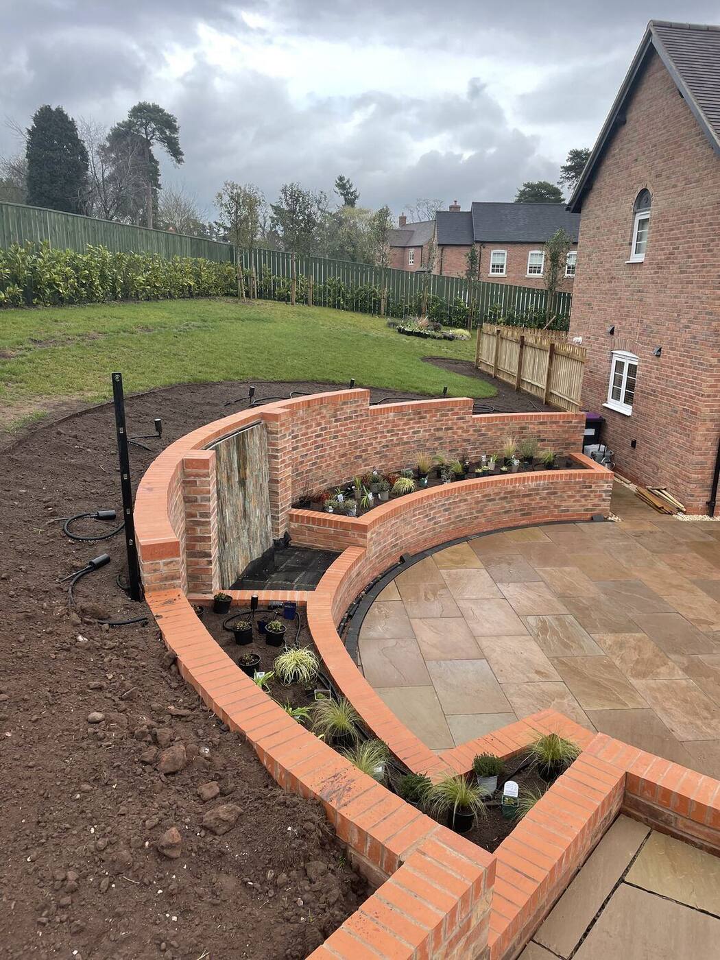 Completed brickwork and paved outdoor area at a family home