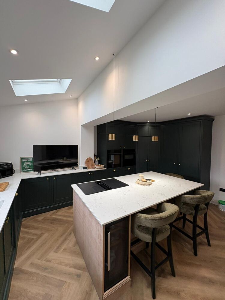 Finished kitchen and dining extension interior with roof lights