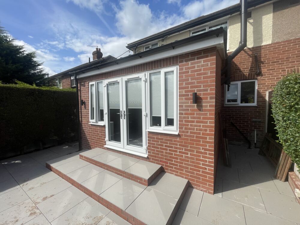 Completed rear house extension with patio doors