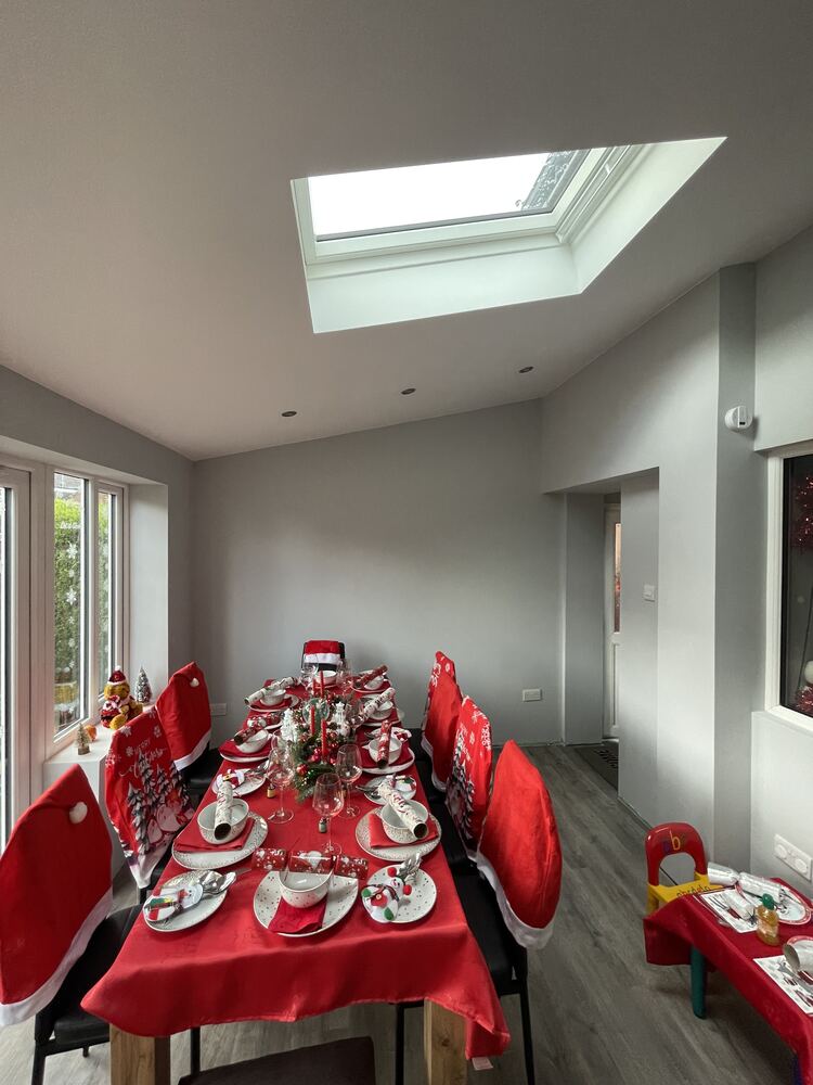 Finished extension interior with roof light and dining space