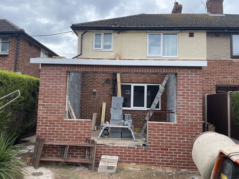 Brick extension with patio door opening and external works