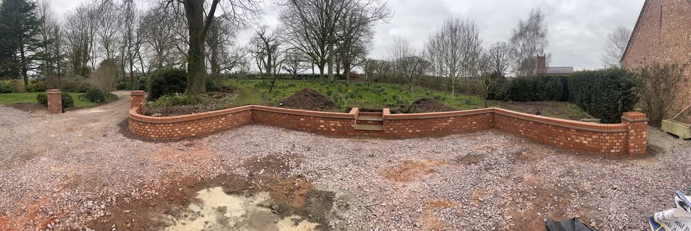 Curved retaining wall landscaping project